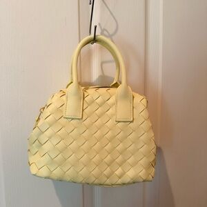 Chic Yellow Lamb Leather Woven Mini Bag with top handle and cross body strap.
